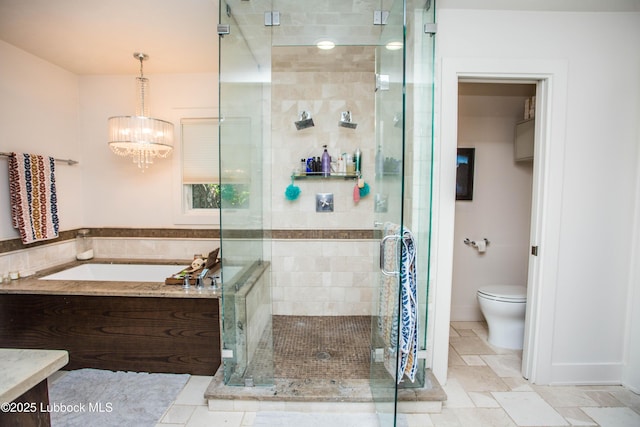 4609 10th St, Lubbock, TX 79416 - full bath featuring a garden tub, a stall shower, toilet, and a chandelier