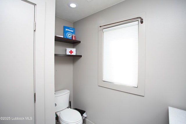 4609 10th St, Lubbock, TX 79416 - bathroom featuring toilet and baseboards