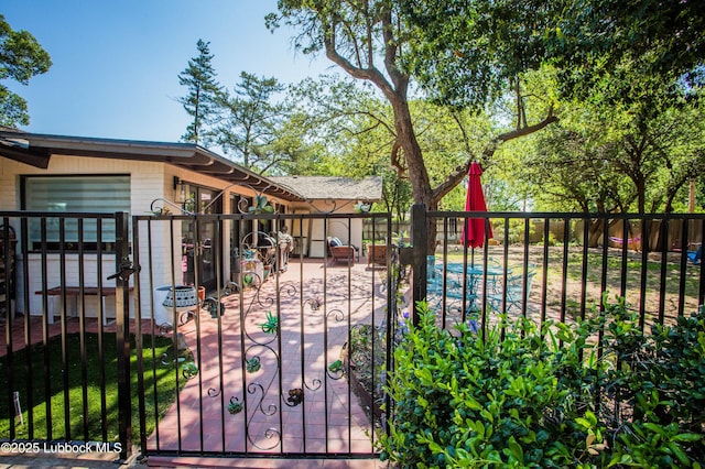 4609 10th St, Lubbock, TX 79416 - gate with a patio area