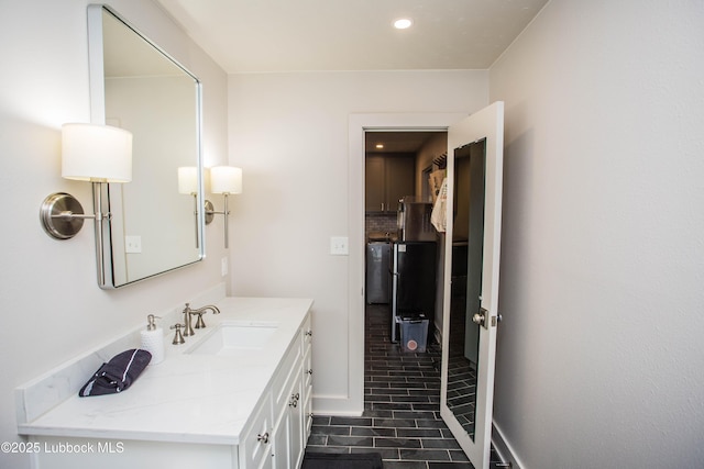 4609 10th St, Lubbock, TX 79416 - bathroom featuring vanity, tile patterned flooring, and recessed lighting
