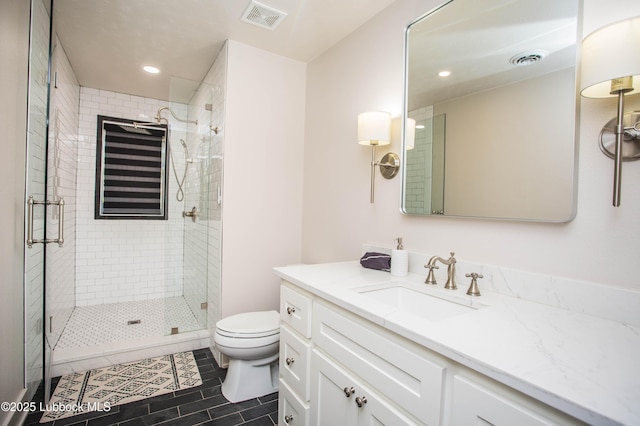 4609 10th St, Lubbock, TX 79416 - bathroom with toilet, recessed lighting, a shower stall, tile patterned floors, and vanity