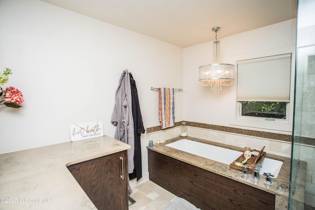 4609 10th St, Lubbock, TX 79416 - bathroom featuring a chandelier, a bath, and tile walls