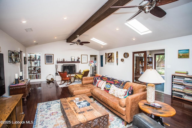 4609 10th St, Lubbock, TX 79416 - living room featuring ceiling fan, wood finished floors, a skylight, recessed lighting, and a fireplace