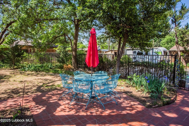 4609 10th St, Lubbock, TX 79416 - fenced backyard featuring a patio and outdoor dining area