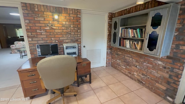 3806 56th St, Lubbock, TX 79413 - office with brick wall and light tile patterned flooring