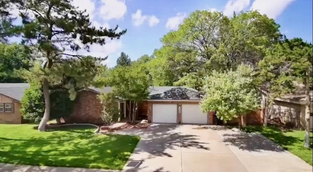 3806 56th St, Lubbock, TX 79413 - obstructed view of property featuring an attached garage, driveway, and a front yard