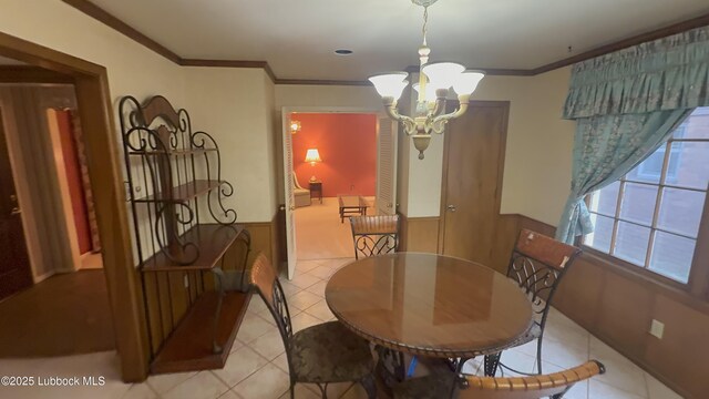 3806 56th St, Lubbock, TX 79413 - dining space with a chandelier, ornamental molding, and light tile patterned floors