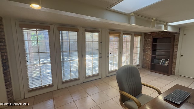 3806 56th St, Lubbock, TX 79413 - home office with light tile patterned floors and built in shelves