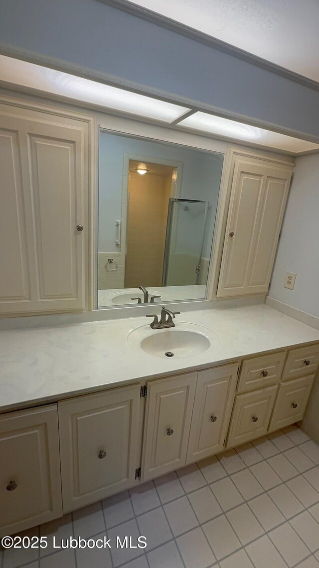 3806 56th St, Lubbock, TX 79413 - bathroom with vanity and tile patterned floors
