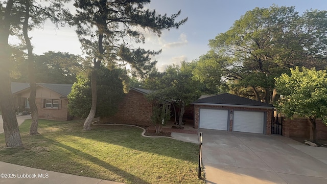 3806 56th St, Lubbock, TX 79413 - view of front of property with a front lawn, brick siding, and concrete driveway