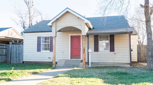 bungalow-style home featuring a front yard