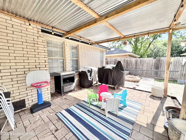 5623 87th St, Lubbock, TX 79424 - fenced backyard featuring a patio area, a fire pit, and area for grilling
