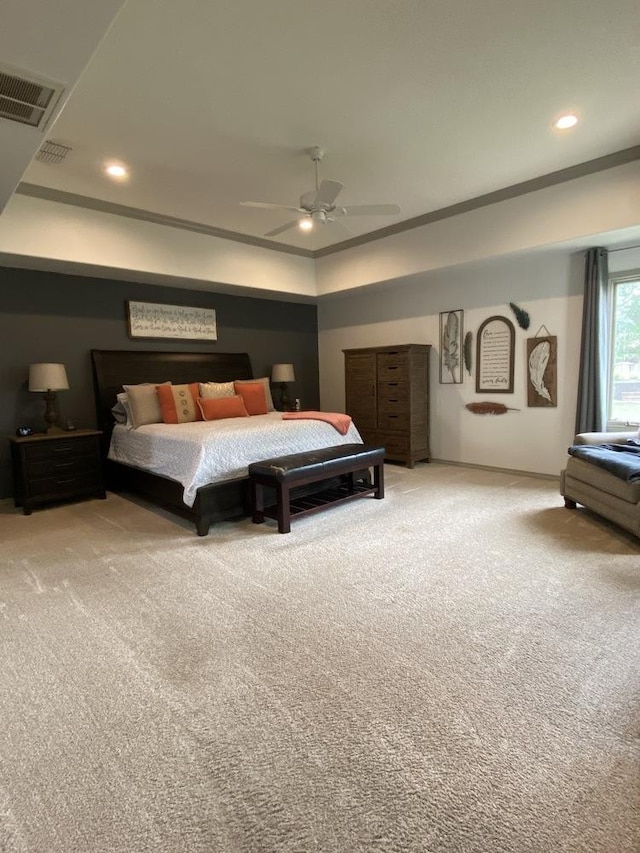 carpeted bedroom with ceiling fan and ornamental molding