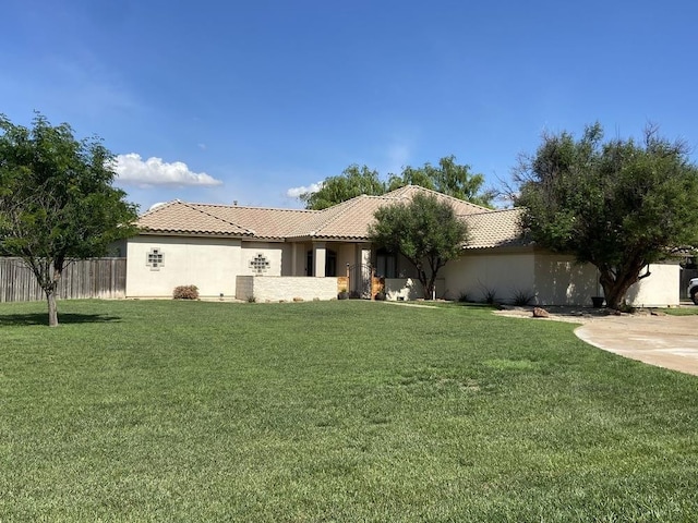 rear view of property with a lawn