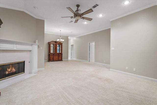 unfurnished living room with crown molding, ceiling fan with notable chandelier, light carpet, and a textured ceiling