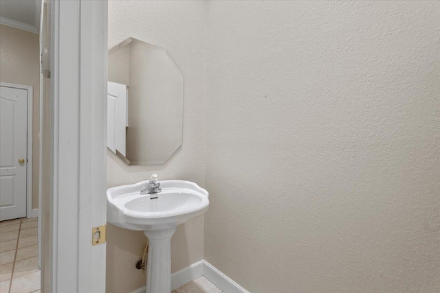 bathroom featuring crown molding and tile patterned floors