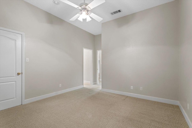 carpeted empty room with ceiling fan