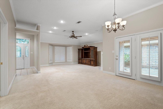 unfurnished living room with crown molding, ceiling fan with notable chandelier, light colored carpet, and a textured ceiling