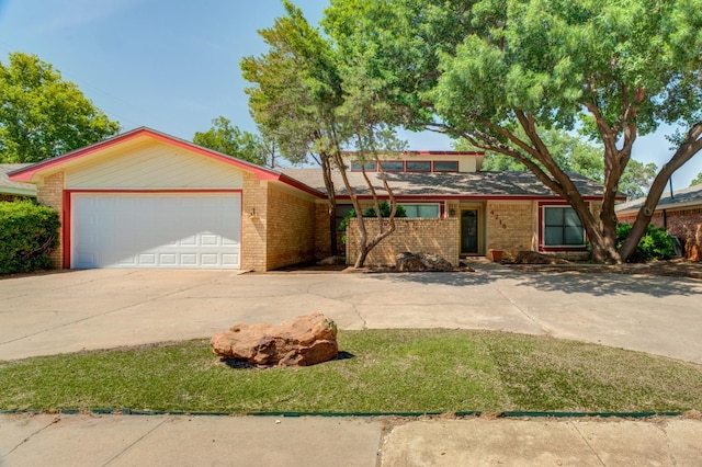 ranch-style house featuring a garage