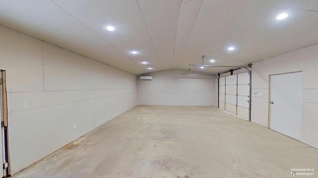 garage with a wall mounted air conditioner