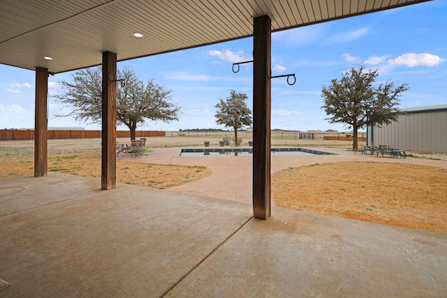 view of yard featuring a fenced in pool and a patio area