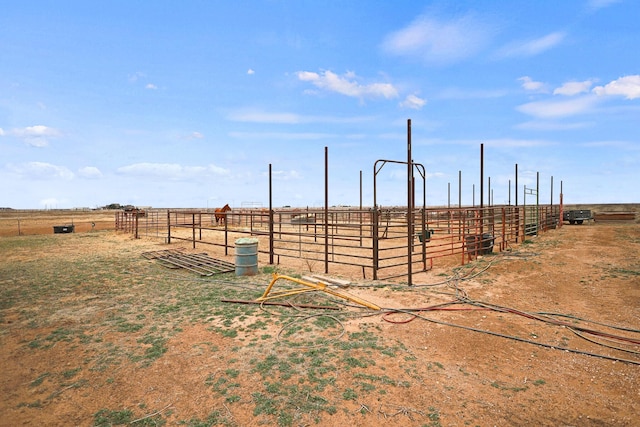 view of yard featuring an outbuilding and a rural view