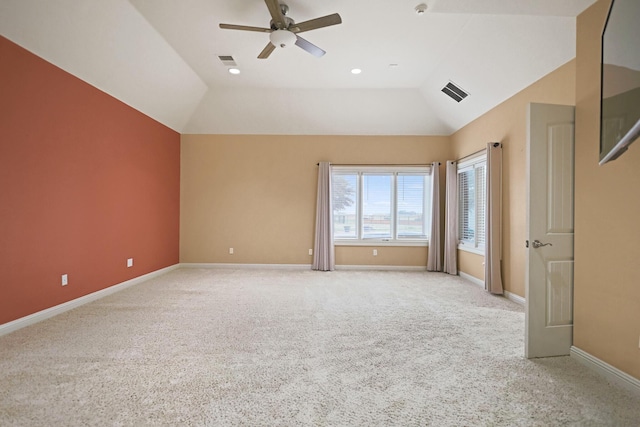 interior space featuring ceiling fan, lofted ceiling, and light carpet