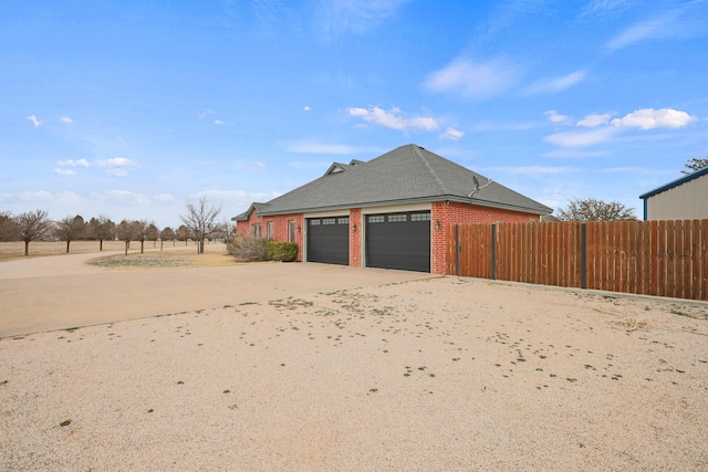 view of property exterior with a garage