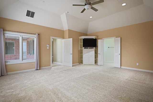 unfurnished bedroom featuring ceiling fan, lofted ceiling, and carpet floors