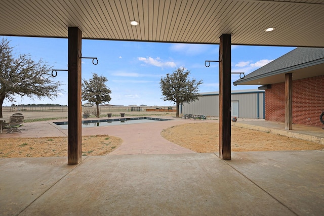 view of patio featuring a fenced in pool