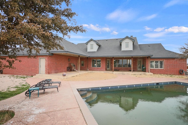 rear view of house featuring a patio area