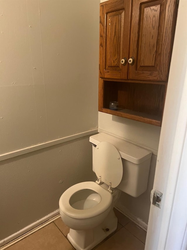 bathroom with tile patterned floors and toilet