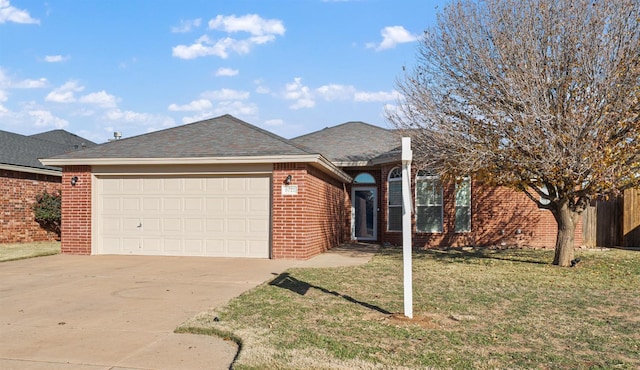 single story home featuring a garage and a front yard