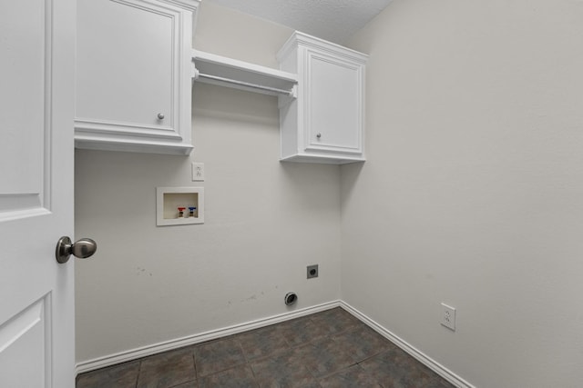 laundry area featuring hookup for a washing machine, electric dryer hookup, cabinets, and a textured ceiling