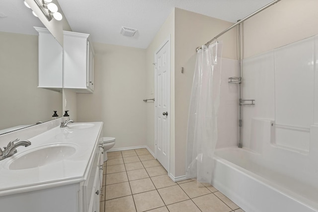 full bathroom featuring vanity, toilet, tile patterned flooring, and shower / bath combo