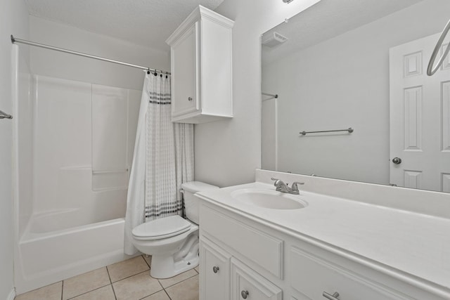 full bathroom with shower / tub combo with curtain, tile patterned flooring, vanity, toilet, and a textured ceiling