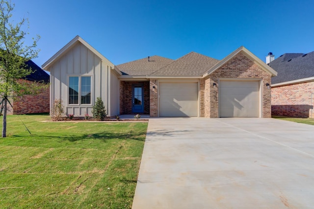 view of front of home featuring a garage and a front yard