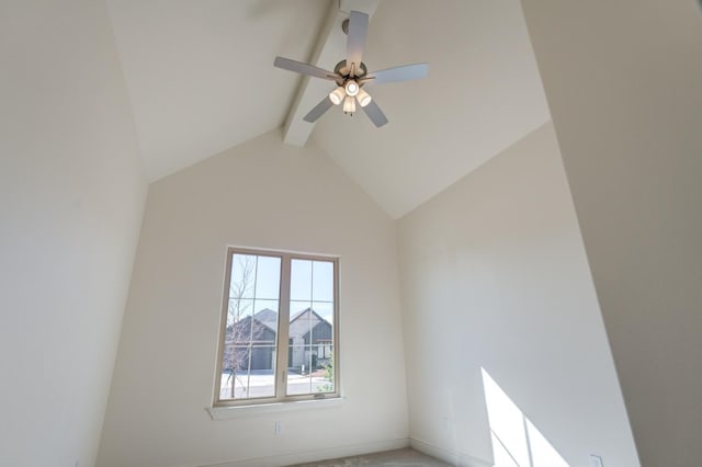 carpeted empty room featuring lofted ceiling with beams and ceiling fan