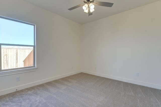 carpeted empty room with ceiling fan