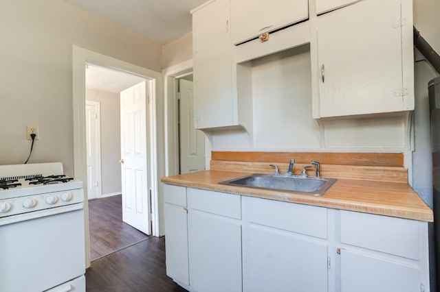 kitchen featuring white cabinetry, sink, dark wood-type flooring, and white gas range oven