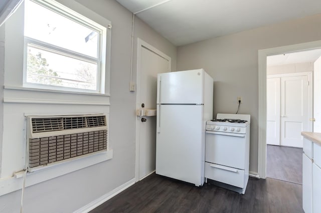 kitchen with white cabinetry, dark hardwood / wood-style flooring, and white appliances