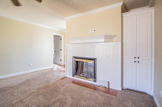 unfurnished living room with ornamental molding, carpet flooring, and a textured ceiling