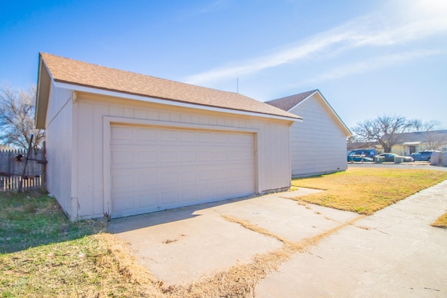 garage featuring a yard