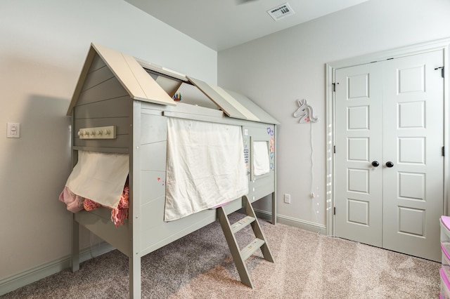 carpeted bedroom featuring a closet