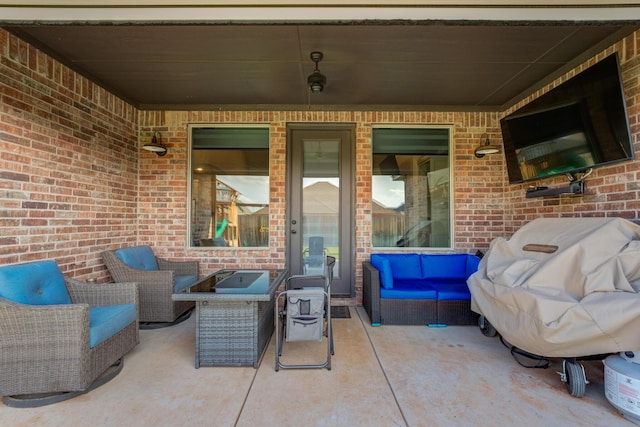 view of patio with a grill and outdoor lounge area