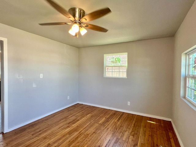 empty room featuring hardwood / wood-style floors and ceiling fan