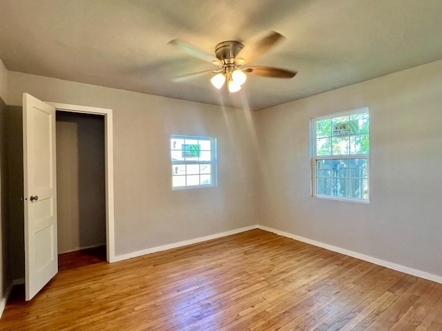 unfurnished bedroom with light hardwood / wood-style flooring and ceiling fan