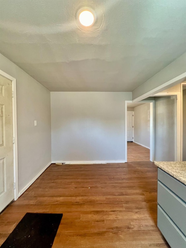 interior space featuring light hardwood / wood-style floors and a textured ceiling