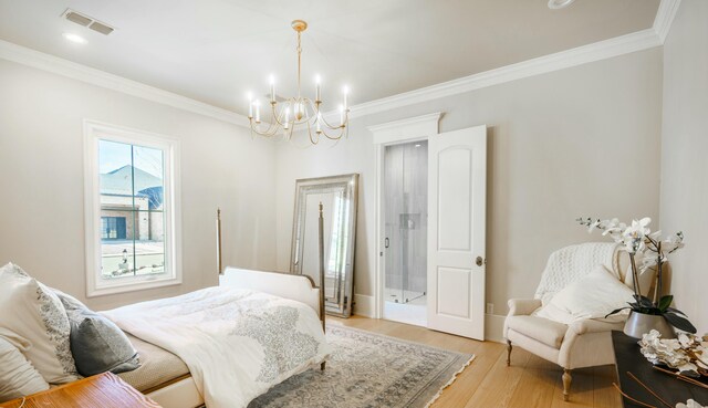 bedroom featuring a notable chandelier, ornamental molding, and light hardwood / wood-style floors