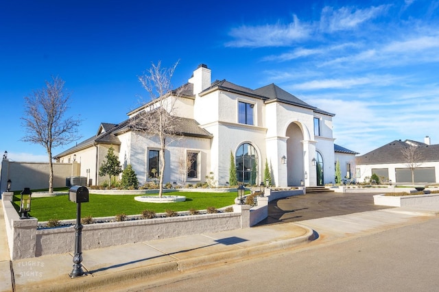 view of front of property with a front lawn